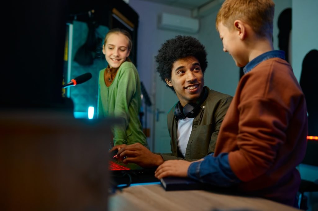 A producer mixing track with children band